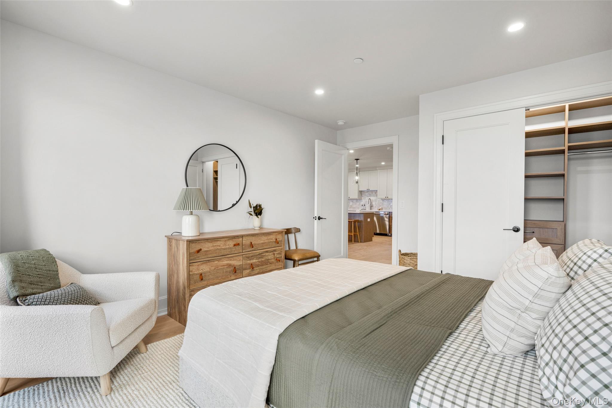 25 South Riverside Avenue, Unit 309 Croton-on-Hudson, NY 10520 - Photo 21 of 26 a bedroom with a bed and a couch