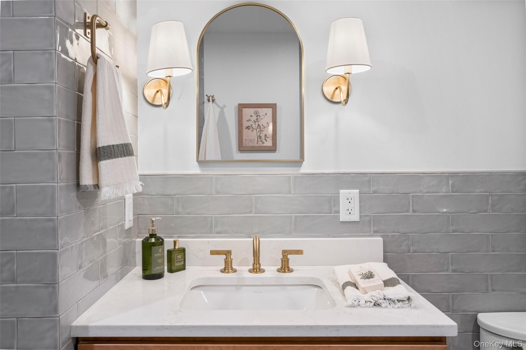 25 South Riverside Avenue, Unit 309 Croton-on-Hudson, NY 10520 - Photo 22 of 26 a bathroom with a sink and a mirror