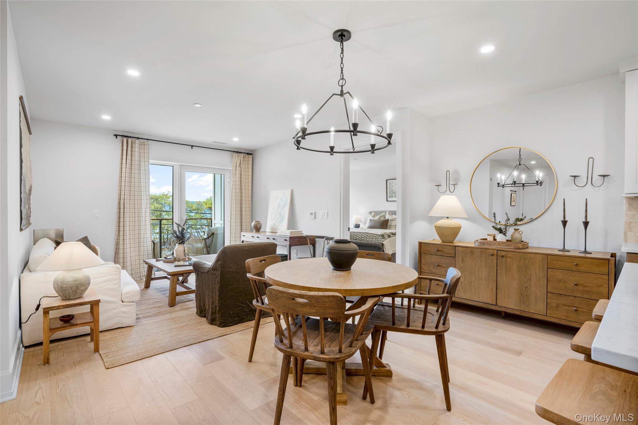 25 South Riverside Avenue, Unit 309 Croton-on-Hudson, NY 10520 - Photo 10 of 26 a view of a dining room with furniture a chandelier and wooden floor