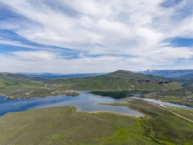 a view of an ocean with a mountain