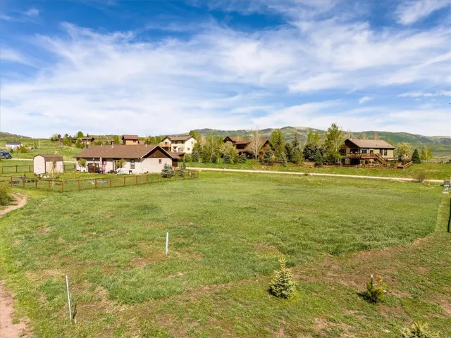 a view of a lake with houses in the back