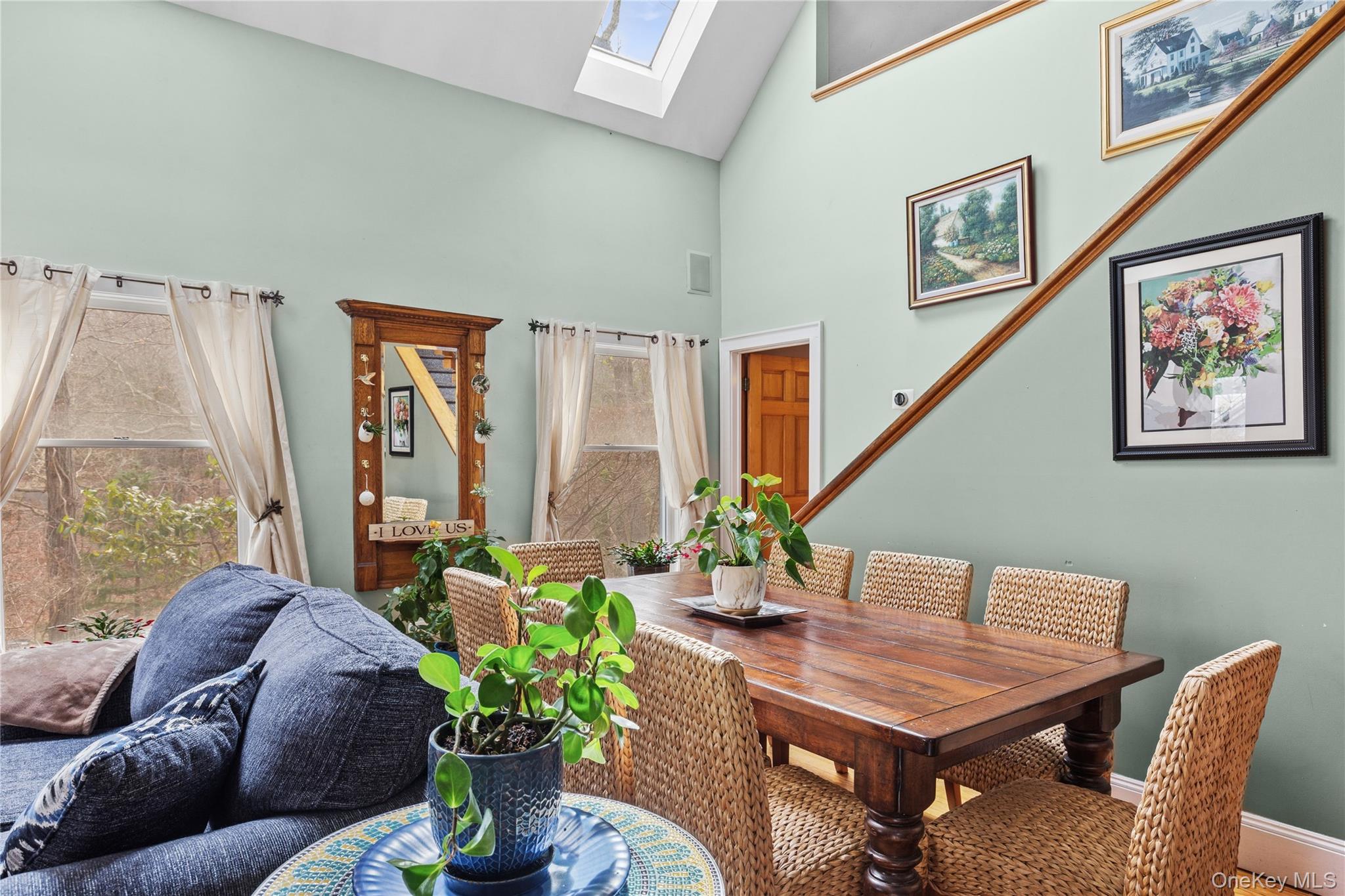 1745 Bay View Avenue Mattituck, NY 11952 - Photo 16 of 37 a living room with furniture and a potted plant