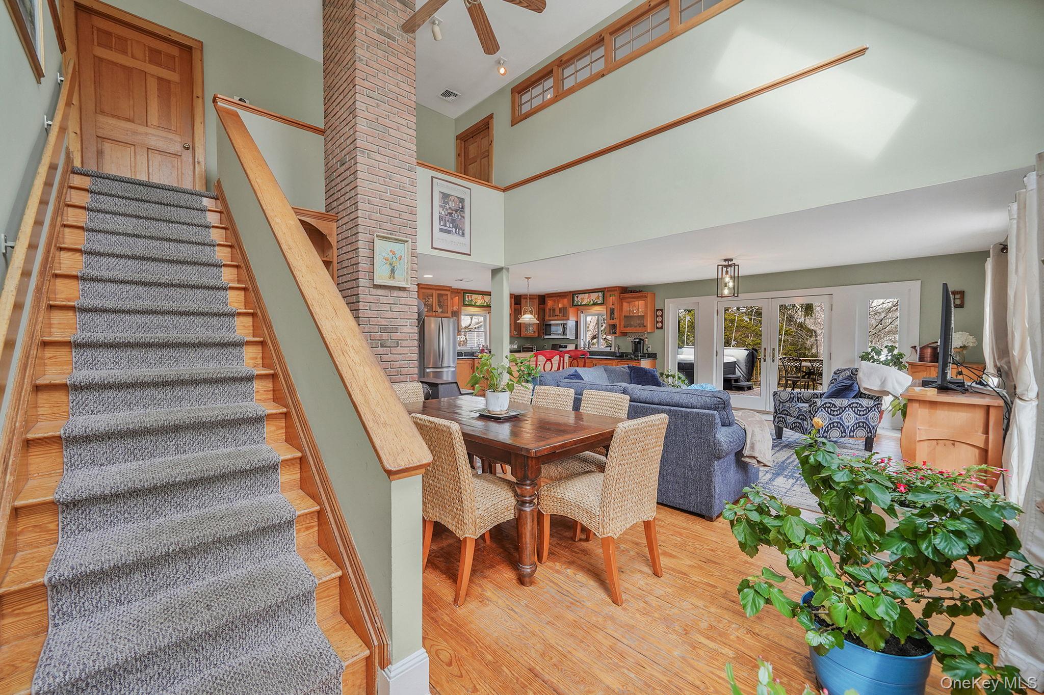 1745 Bay View Avenue Mattituck, NY 11952 - Photo 19 of 37 a view of a dining room with furniture and a potted plant