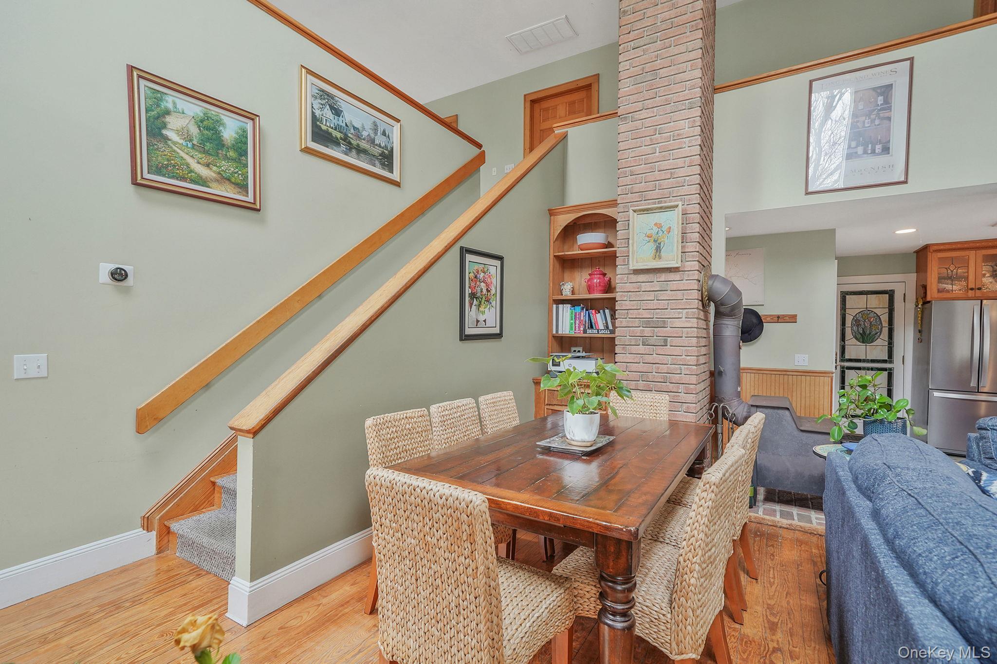 1745 Bay View Avenue Mattituck, NY 11952 - Photo 20 of 37 a dining room with furniture and wooden floor