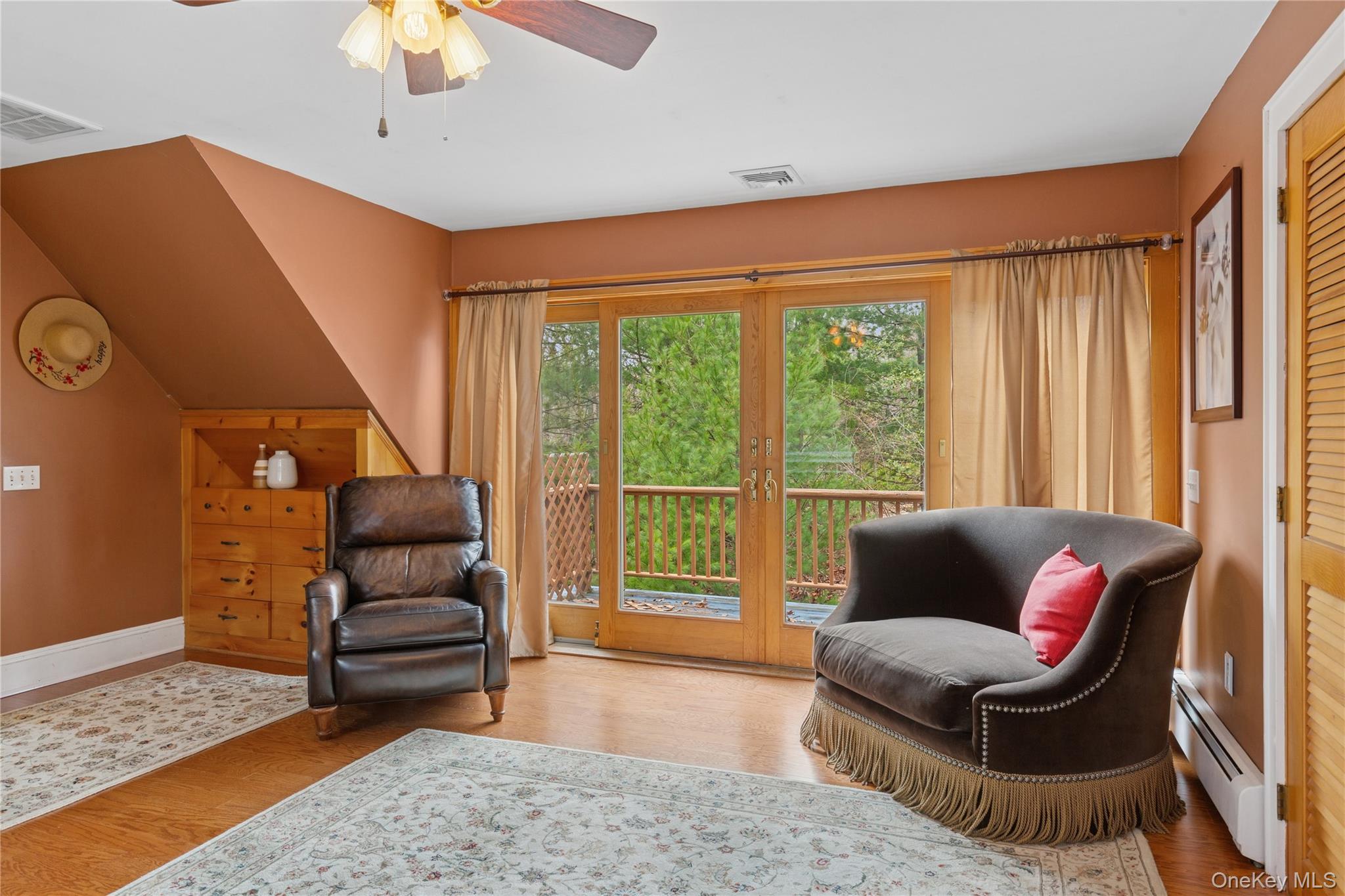 1745 Bay View Avenue Mattituck, NY 11952 - Photo 22 of 37 a living room with furniture and a large window