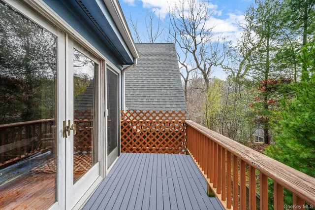 a balcony view with wooden floor and fence