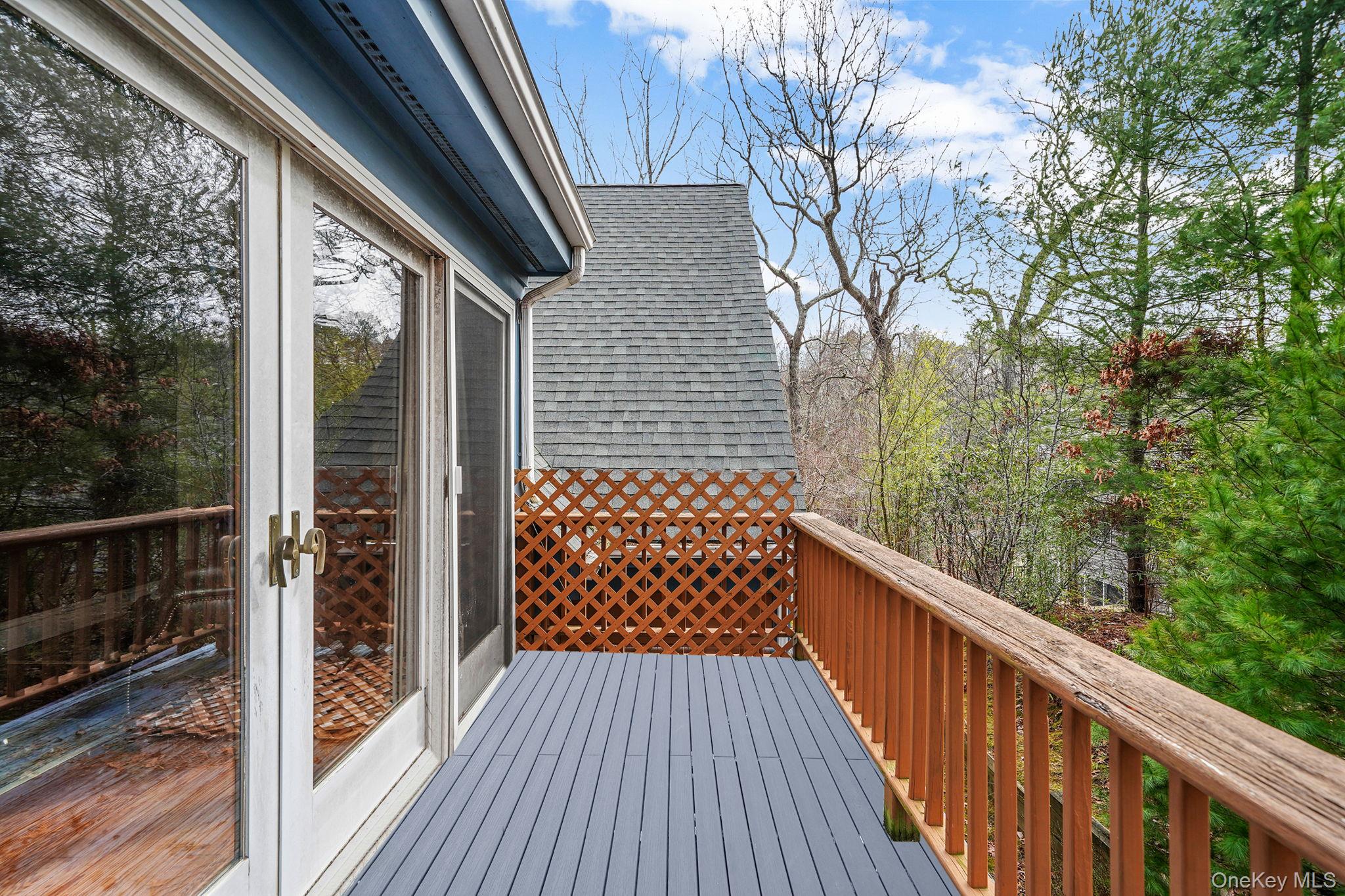 1745 Bay View Avenue Mattituck, NY 11952 - Photo 23 of 37 a balcony view with wooden floor and fence