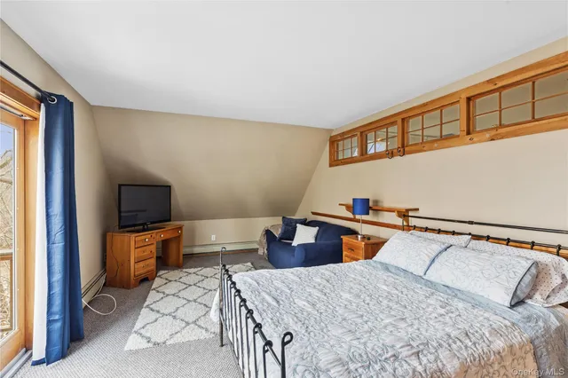 a bedroom with a bed and furniture