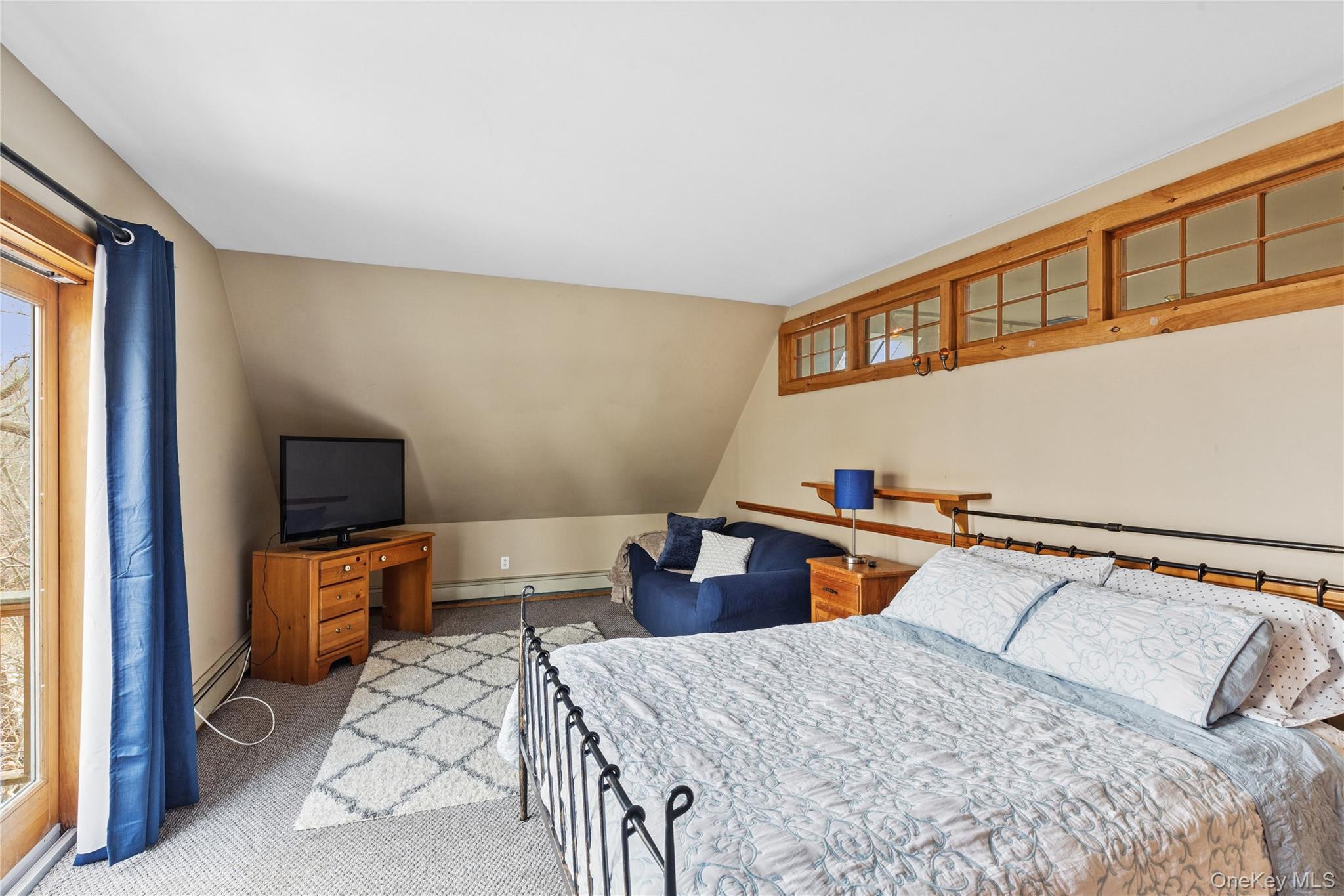 1745 Bay View Avenue Mattituck, NY 11952 - Photo 26 of 37 a bedroom with a bed and furniture