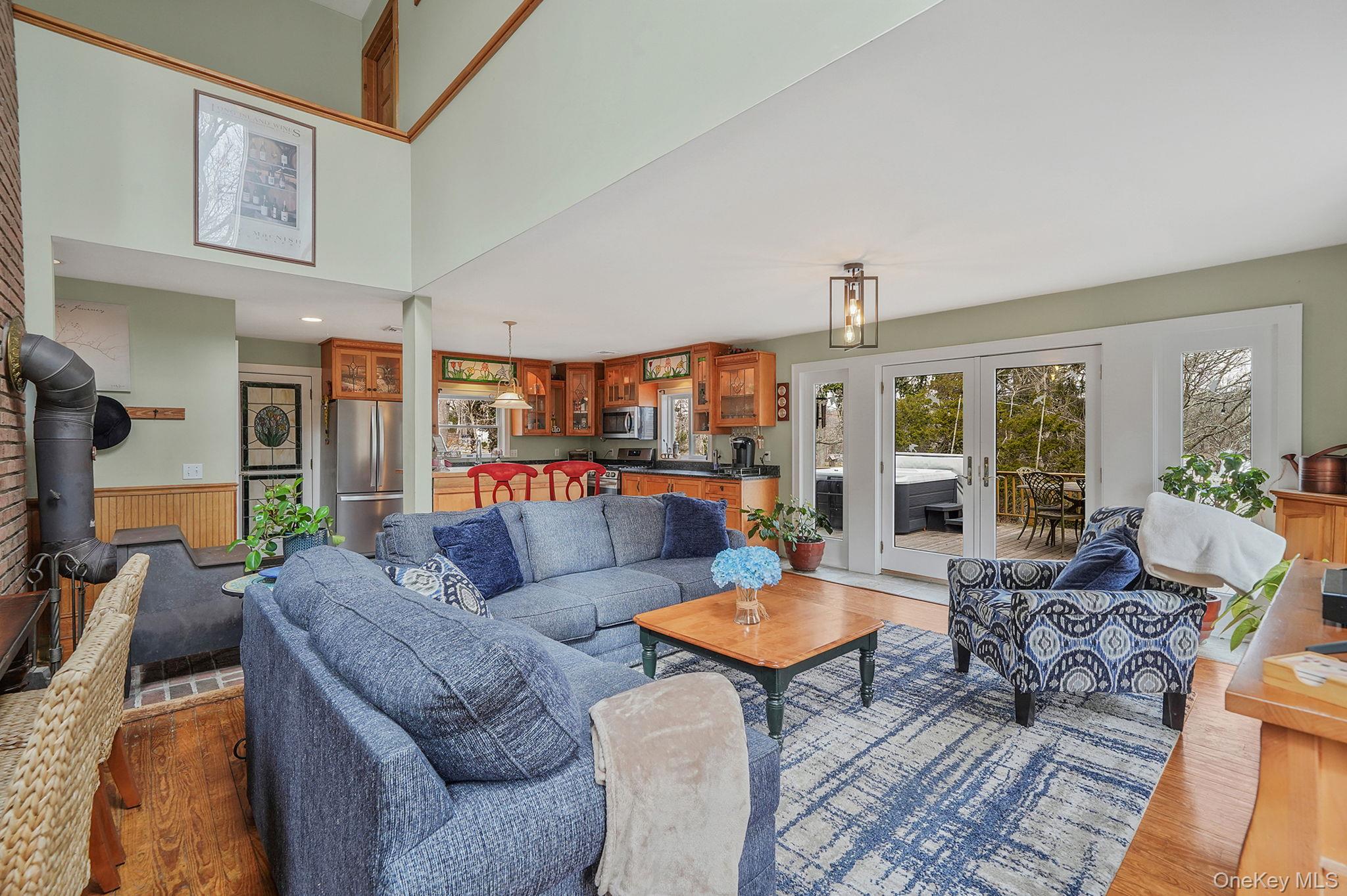 1745 Bay View Avenue Mattituck, NY 11952 - Photo 8 of 37 a living room with furniture and a large window