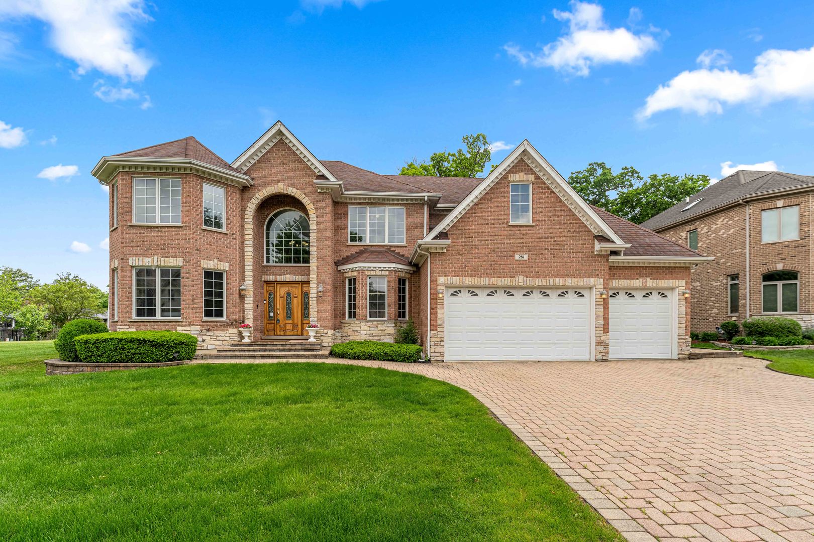281 Forest Drive Addison, IL 60101 - Photo 1 of 14 a front view of a house with a garden and yard