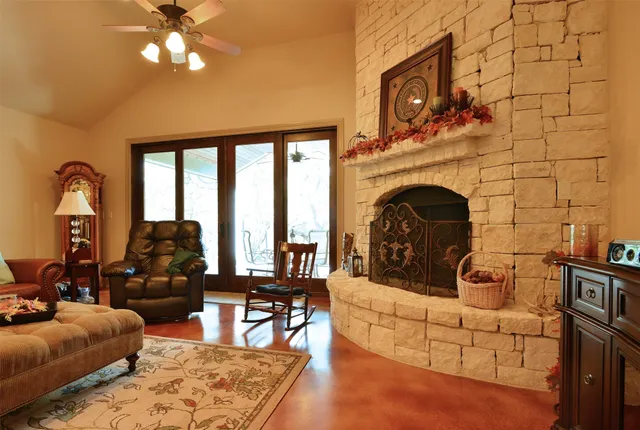 a living room with furniture and a fireplace