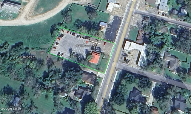 an aerial view of a residential houses with outdoor space