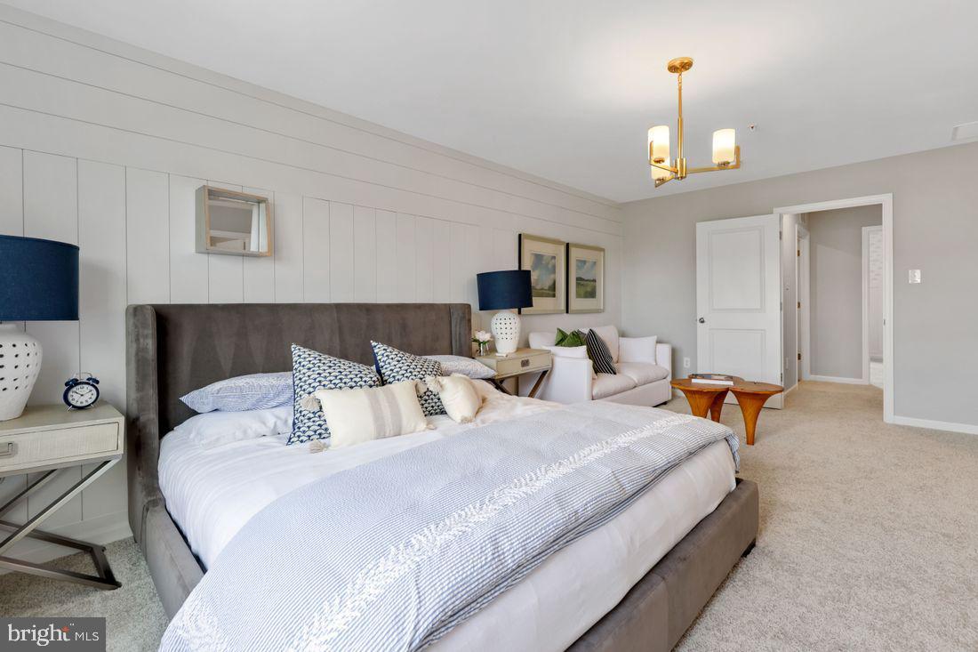 92 Open Gate Lane Shepherdstown, WV 25443 - Photo 23 of 40 a bedroom with bed a chandelier and a couch