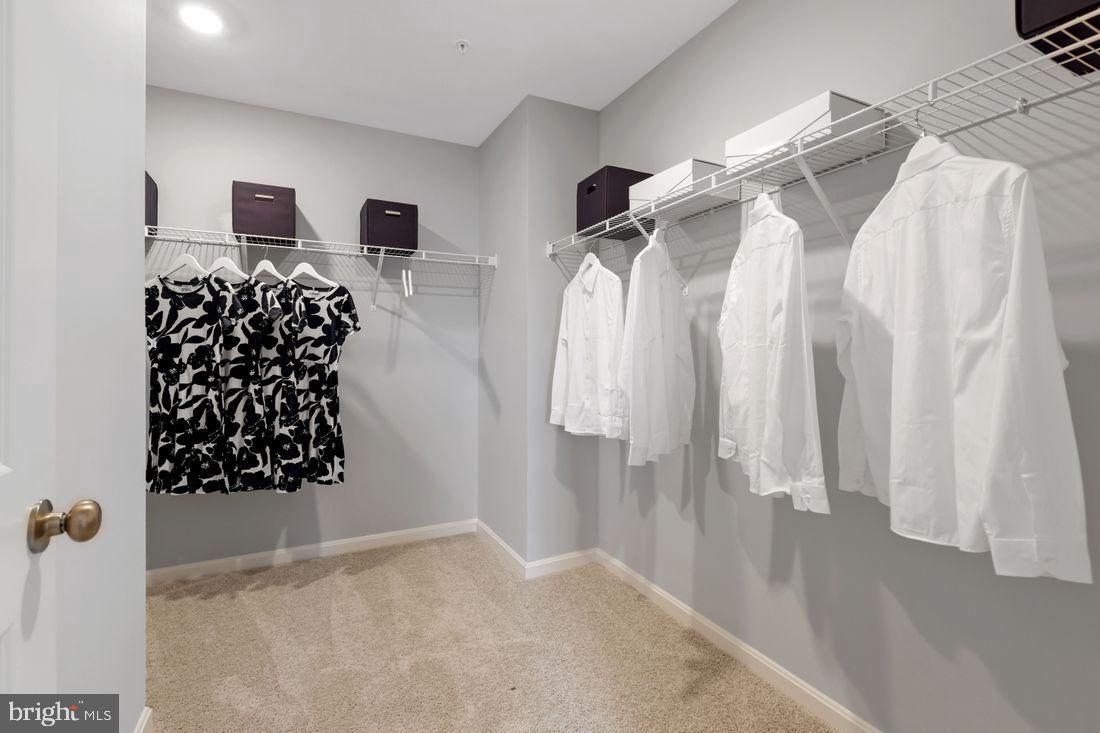92 Open Gate Lane Shepherdstown, WV 25443 - Photo 26 of 40 a view of walk in closet with clothes and shoes