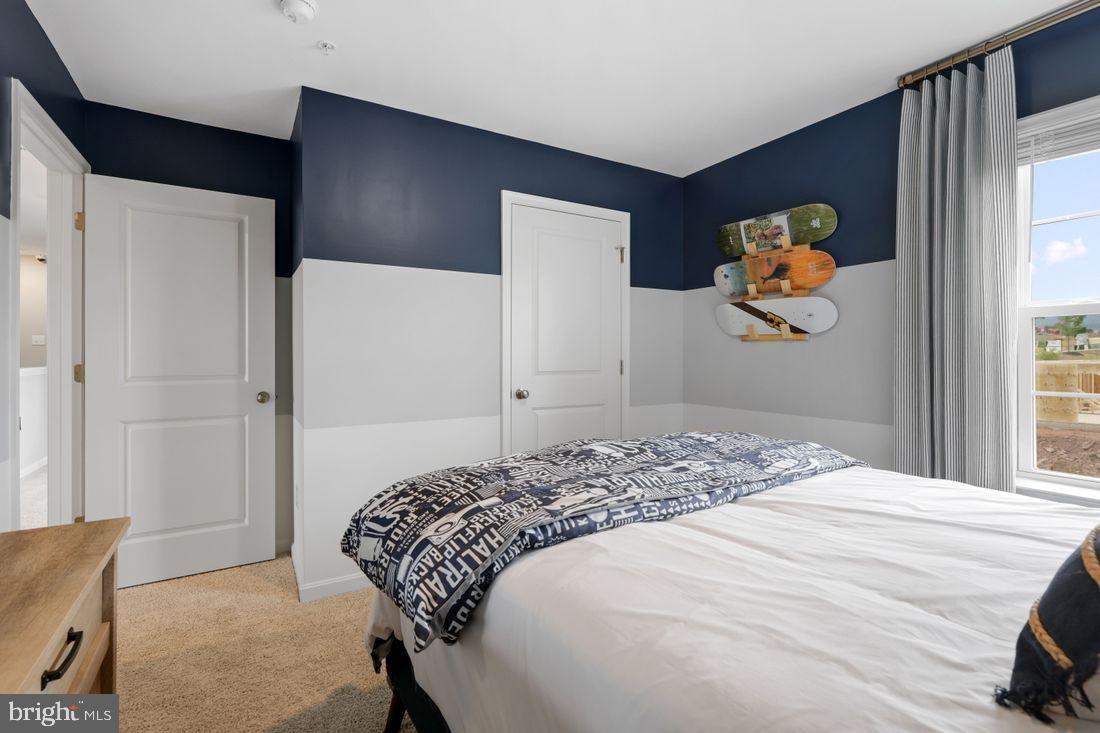 92 Open Gate Lane Shepherdstown, WV 25443 - Photo 32 of 40 a bedroom with a bed and painting on the wall