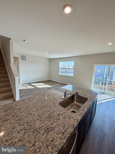 92 Open Gate Lane Shepherdstown, WV 25443 - Photo 6 of 40 a kitchen with granite countertop a sink and a stove