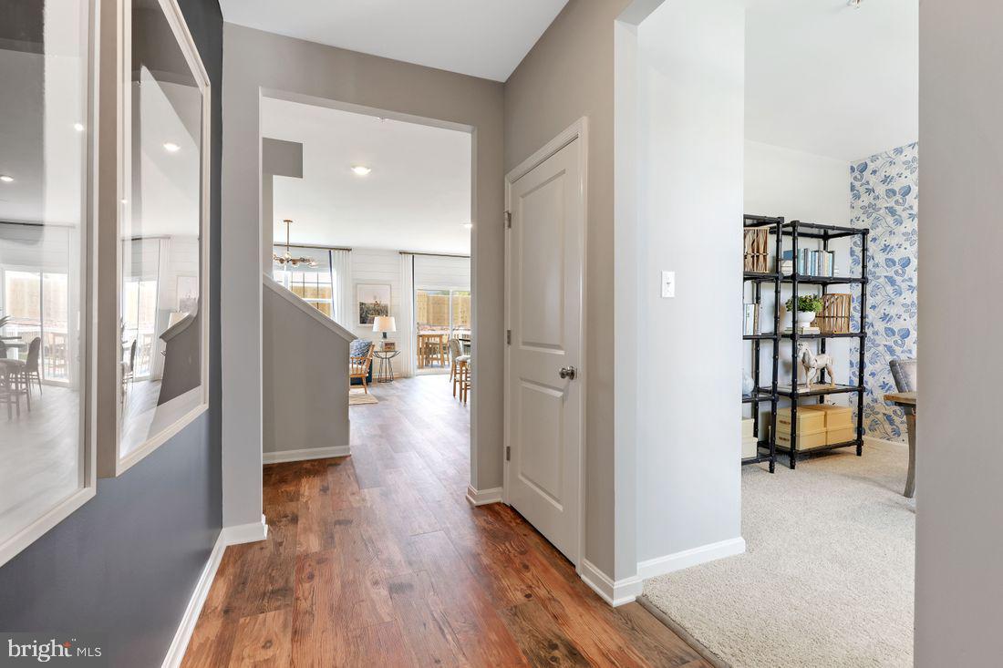 92 Open Gate Lane Shepherdstown, WV 25443 - Photo 7 of 40 a view of a hallway with wooden floor and cabinets
