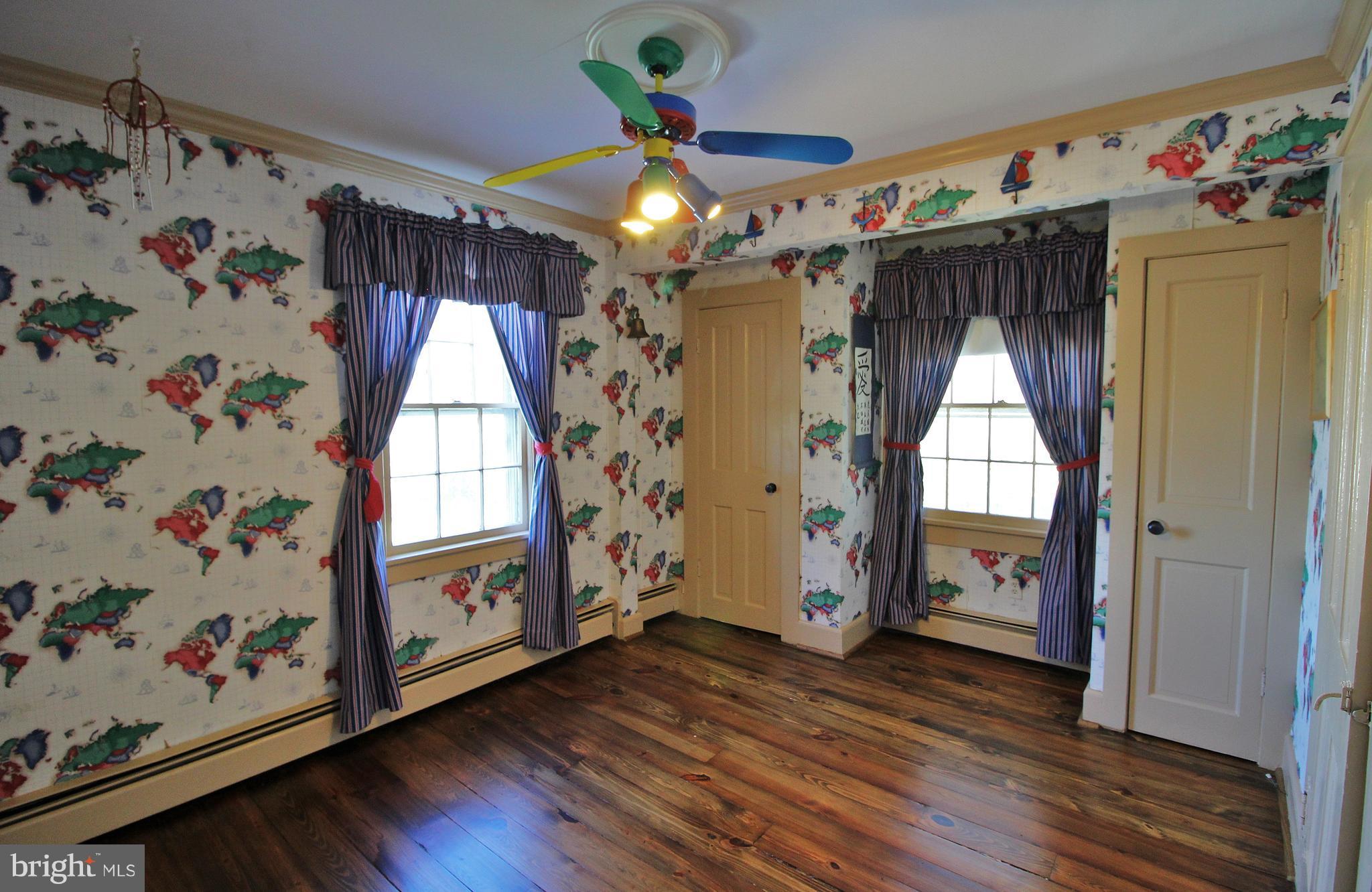 24300 Peach Tree Road Clarksburg, MD 20871 - Photo 14 of 28 a view of a livingroom with wooden floor and a window