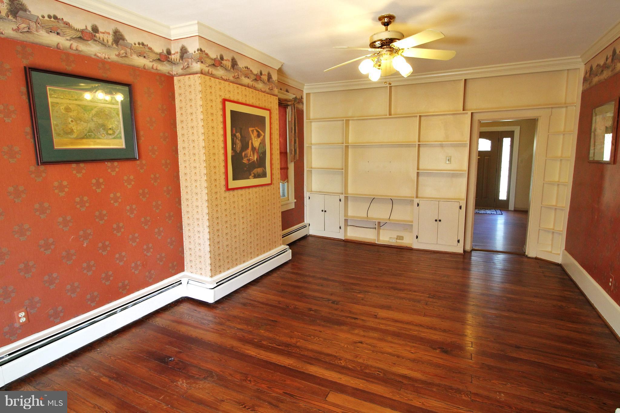 24300 Peach Tree Road Clarksburg, MD 20871 - Photo 3 of 28 wooden floor in an empty room with a window