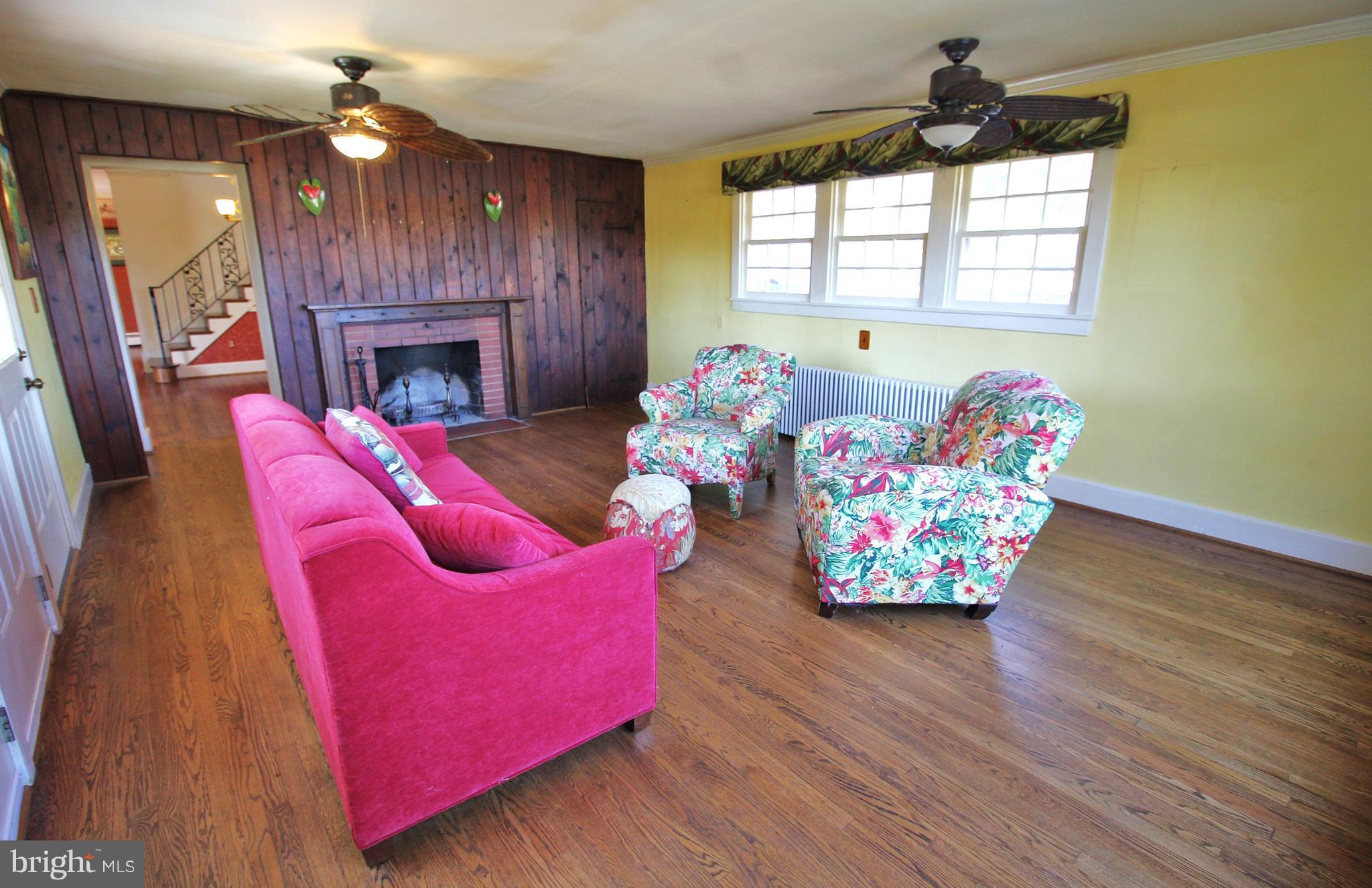 24300 Peach Tree Road Clarksburg, MD 20871 - Photo 5 of 28 a living room with furniture fireplace and window