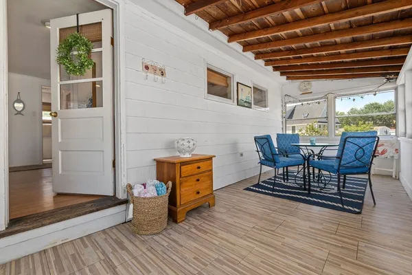 a dining room with furniture and wooden floor