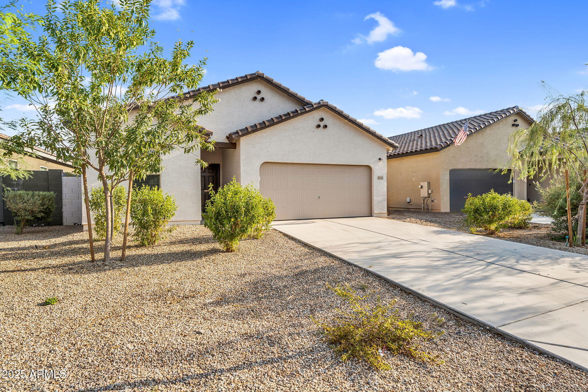 6113 East Athena Road Florence, AZ 85132 - Photo 19 of 19 a front view of a house with garden