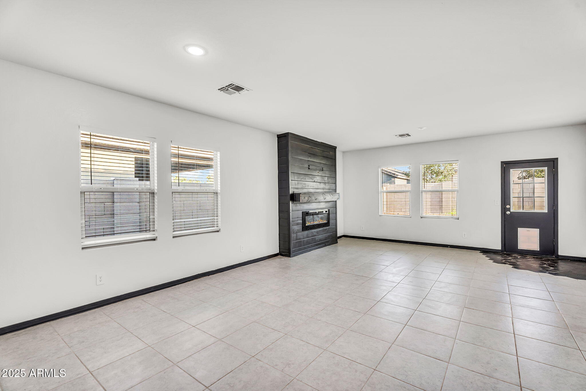 6113 East Athena Road Florence, AZ 85132 - Photo 3 of 19 an empty room with windows