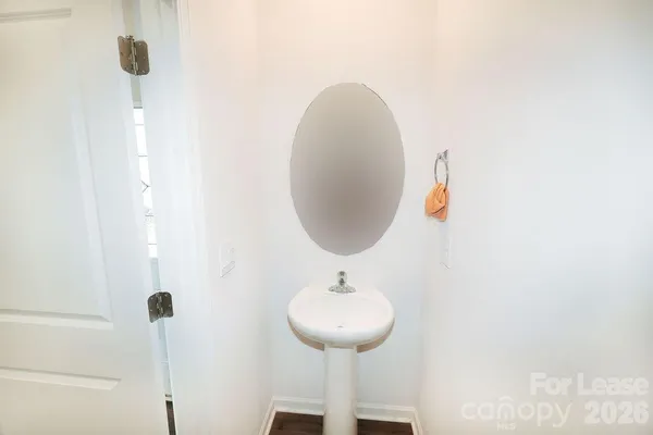a bathroom with a sink and mirror