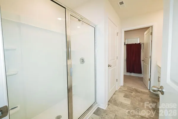 a view of hallway with shower