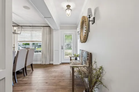 a view of dining room with furniture and wooden floor