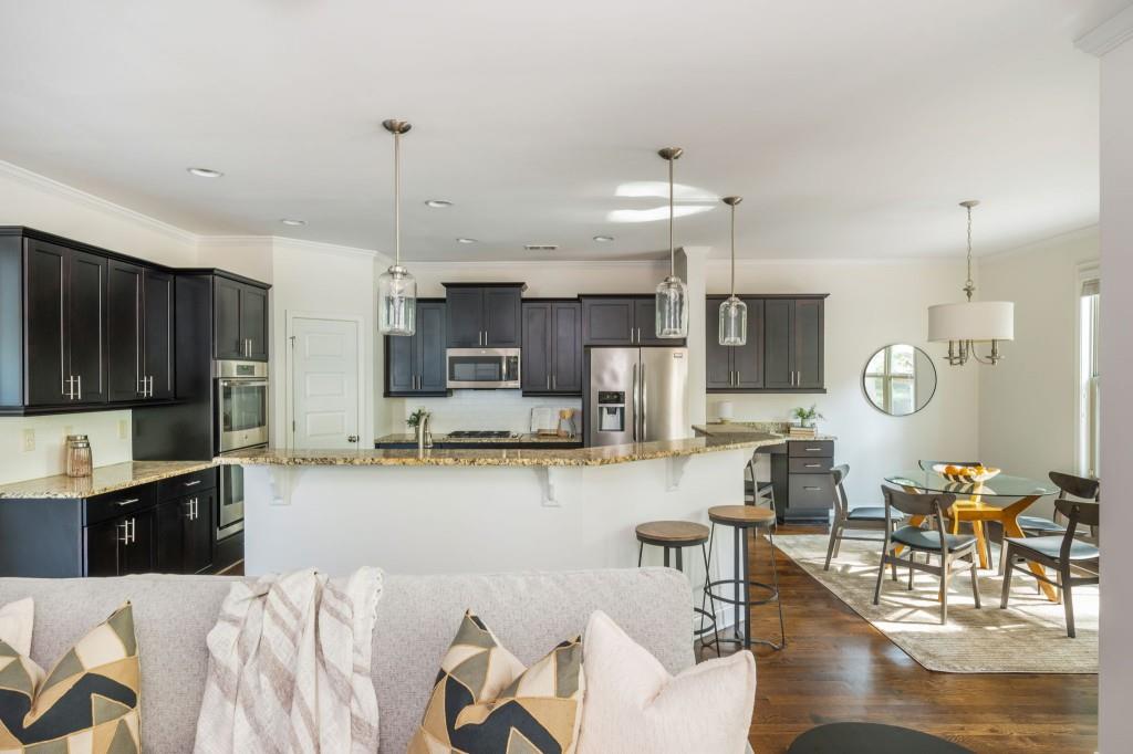 371 Hooper Street Southeast Atlanta, GA 30317 - Photo 12 of 29 a large kitchen with lots of counter space and stainless steel appliances