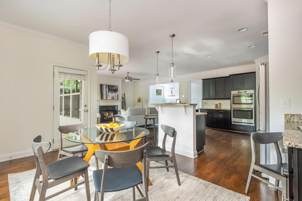 371 Hooper Street Southeast Atlanta, GA 30317 - Photo 16 of 29 a dining room filled chandelier and wooden floor