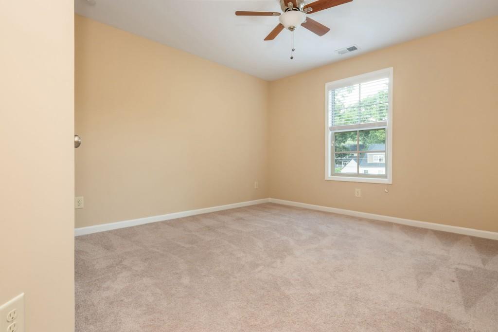 371 Hooper Street Southeast Atlanta, GA 30317 - Photo 25 of 29 an empty room with a window and a fan