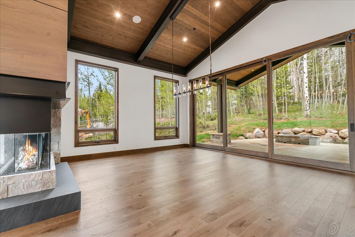 1615 Golden Eagle Road Silverthorne, CO 80498 - Photo 15 of 47 a view of an empty room with wooden floor and a window
