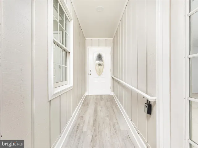 a view of a hallway with windows