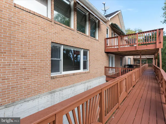 a view of deck with wooden floor and outdoor seating