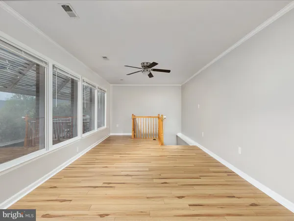 a large white bed in a white room