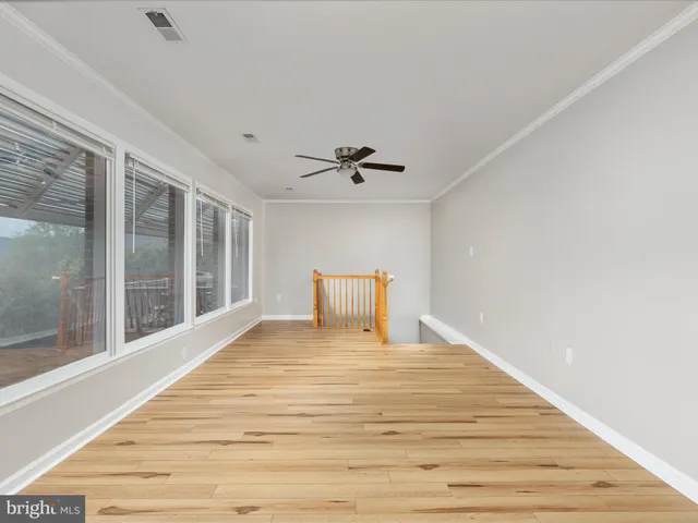 a large white bed in a white room