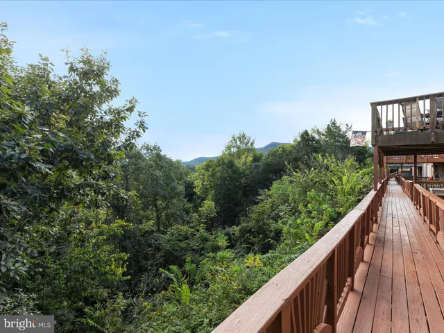 a view of balcony with deck and wooden floor