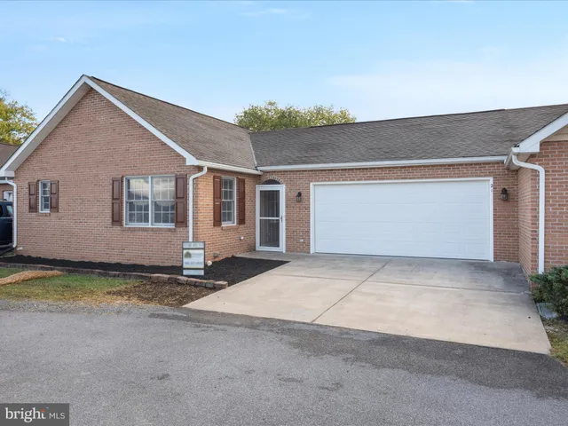 a balcony with wooden floor and outdoor space