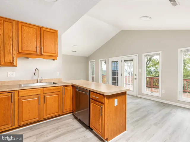 a kitchen with a sink and a refrigerator