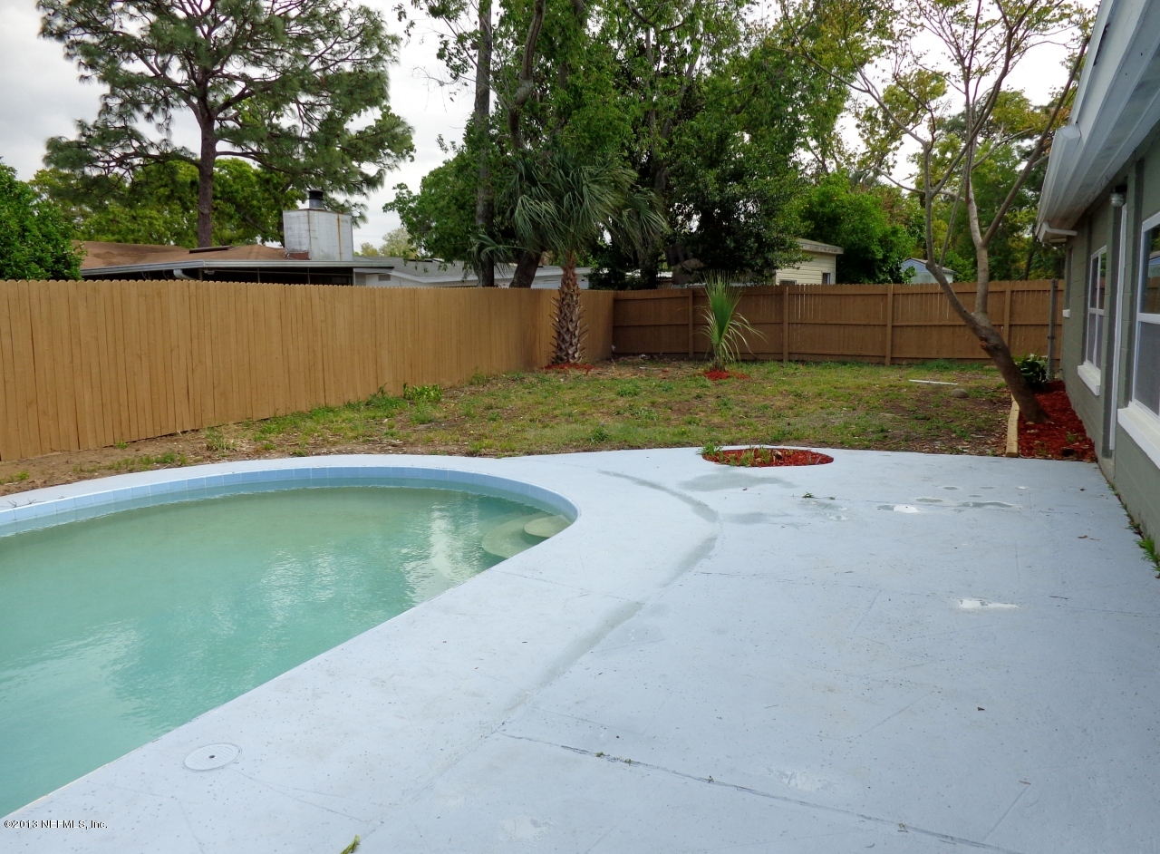 3857 Rogero Road Jacksonville, FL 32277 - Photo 11 of 24 fenced backyard