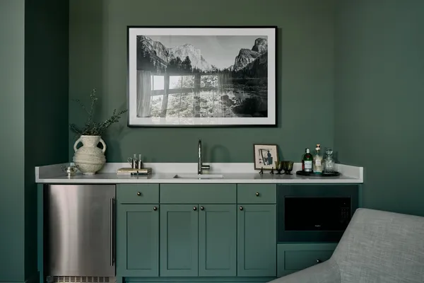 a view of cabinets with sink and wooden floor