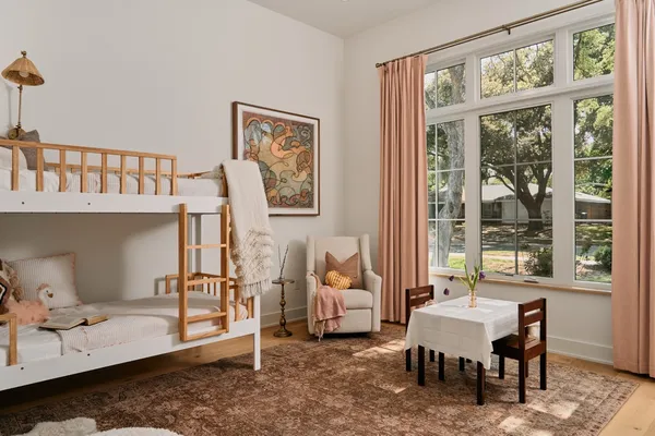 a living room with furniture a window and a table