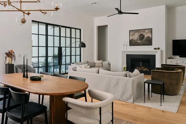 a view of a dining room with furniture window and wooden floor