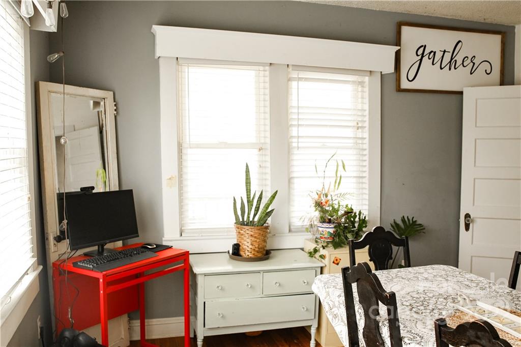 1052 Greenwood Road Spruce Pine, NC 28777 - Photo 17 of 43 a view of a workspace with furniture and a window