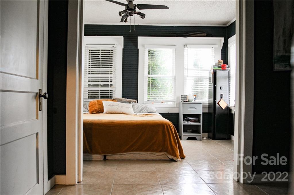 1052 Greenwood Road Spruce Pine, NC 28777 - Photo 27 of 43 a bedroom with a bed and a dresser