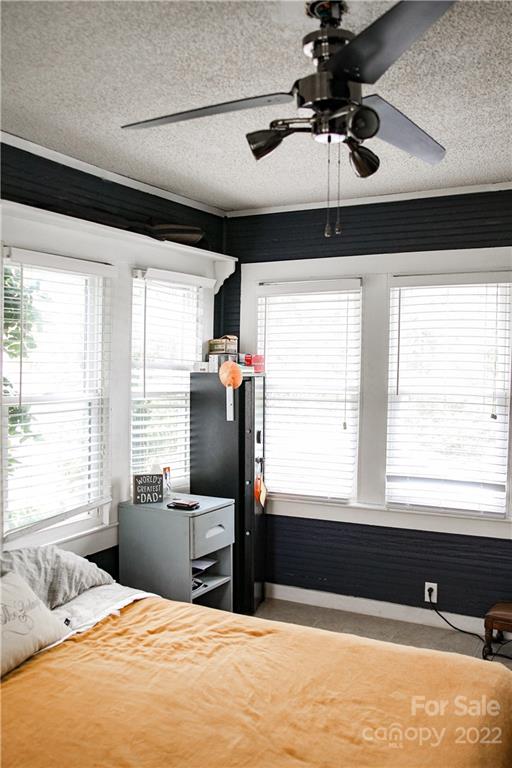 1052 Greenwood Road Spruce Pine, NC 28777 - Photo 29 of 43 a bedroom with a bed and window