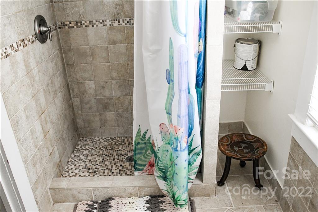 1052 Greenwood Road Spruce Pine, NC 28777 - Photo 35 of 43 a bathroom with a sink and a mirror